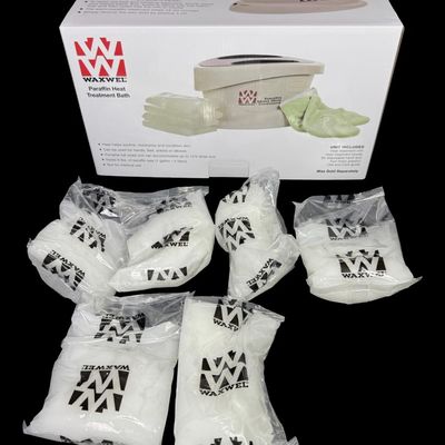 Sale Photo Thumbnail #162: This unit has never been opened or used. Included are six unopened bags of paraffin wax. [RS]