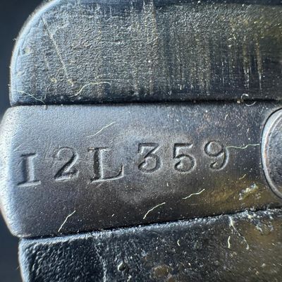 Sale Photo Thumbnail #169: The Enfield No. 2 is a British top break double action revolver using the .38 S&W round manufactured from 1930 to 1957. It was the standard British/Empire sidearm in the Second World War. It holds six rounds, has Bakelite grips, and has a five inch barrel
