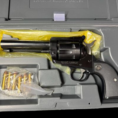 Sale Photo Thumbnail #179: This Single Six fires the Remington caliber .41 magnum. It has a six round capacity. It has a fully windage and elevation rear sight. It is made from alloy steel with a blued finish, and has polymer grips. The barrel length is 4.62 inches. Also included i