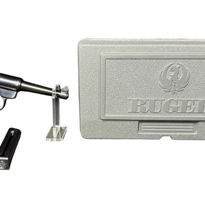 Sale Photo Thumbnail #186: The Ruger Mark 2 is a semi-automatic .22 long rifle rimfire pistol introduced in 1982 as an upgrade to the original Ruger Standard. It has a 10+1 capacity. It has a 4.75” barrel with fixed sights, and rubber ergonomic grips. The overall length is 9.5 in
