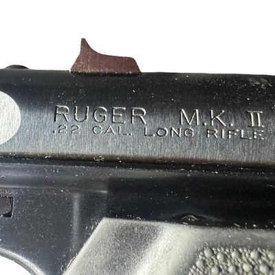 Sale Photo Thumbnail #187: The Ruger Mark 2 is a semi-automatic .22 long rifle rimfire pistol introduced in 1982 as an upgrade to the original Ruger Standard. It has a 10+1 capacity. It has a 4.75” barrel with fixed sights, and rubber ergonomic grips. The overall length is 9.5 in
