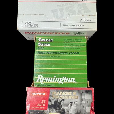Sale Photo Thumbnail #207: Includes an unopened box of Winchester .40 S&W, 165 grain, full metal jacket ammo (100 rounds); 36 rounds of Norma .32 auto, 73 grain, full metal jacket ammo; and 5 rounds of Remington .40 S&W, 165 grain, hollow point ammo. Total of 141 rounds. NO SHIPPIN