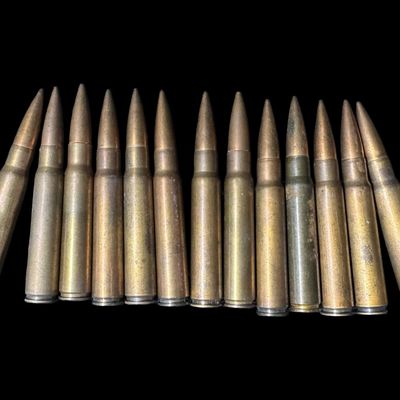 Sale Photo Thumbnail #238: Includes a WW2-era ammo belt with eleven 5-round clips, and 22 assorted rounds. Total of 77 rounds of 7.92x57mm Mauser (8mm). The P-code on some of these rounds implies that they are WW2 Nazi Germany Mauser ammunition. NO SHIPPING ON AMMUNITION. [CS]