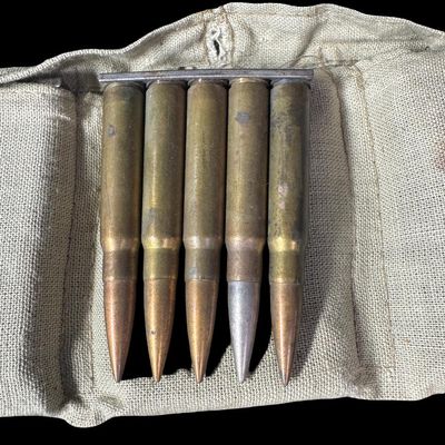 Sale Photo Thumbnail #237: Includes a WW2-era ammo belt with eleven 5-round clips, and 22 assorted rounds. Total of 77 rounds of 7.92x57mm Mauser (8mm). The P-code on some of these rounds implies that they are WW2 Nazi Germany Mauser ammunition. NO SHIPPING ON AMMUNITION. [CS]