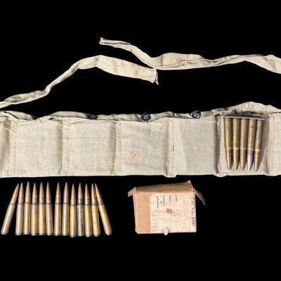Sale Photo Thumbnail #236: Includes a WW2-era ammo belt with eleven 5-round clips, and 22 assorted rounds. Total of 77 rounds of 7.92x57mm Mauser (8mm). The P-code on some of these rounds implies that they are WW2 Nazi Germany Mauser ammunition. NO SHIPPING ON AMMUNITION. [CS]