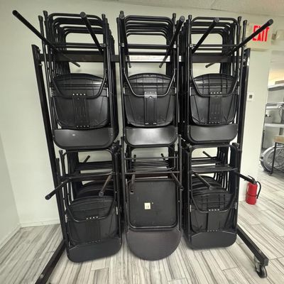 Sale Photo Thumbnail #240: Includes 40 folding chairs on a rolling storage rack. The rack measures 6’ high, by 5’ wide. [RS]
