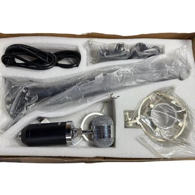 Sale Photo Thumbnail #244: This piece features a black-bodied microphone with silver/chrome grill. It includes a suspension boom arm, a shock mount, cables, and hardware. In the original box. Not tested. [RS]