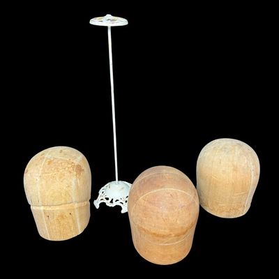 Sale Photo Thumbnail #270: Includes three vintage wooden hat blocks and a cast Victorian hat stand. Two of the hat blocks are balsa, or cork, and the other is wood. The hat stand measures 20 inches tall. [RS]