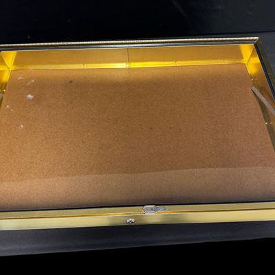 Sale Photo Thumbnail #367: Includes one box with hinges, and no lock. Also includes a brass-tone metal display that is missing the key. Measurement of brass-tone box: 34” x 22.5”. [RS]