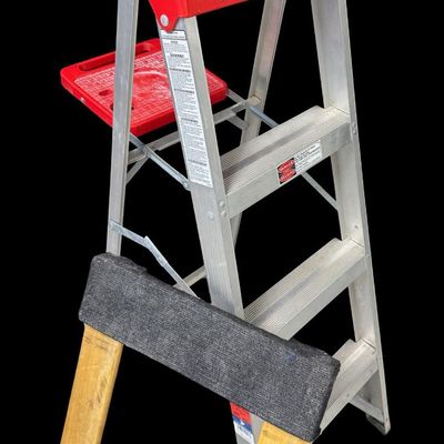 Sale Photo Thumbnail #398: Includes a Gorilla ladder with platform, a Louisville aluminum ladder, a furniture dolly, and a boat display stand. Total of four pieces. [RS]