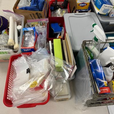 Sale Photo Thumbnail #410: Includes jewelry props, jewelry bags, jewelry boxes, and other jewelry supplies. Also includes storage, electrical cords, multi-plugs, binders, folders, light bulbs, a 1920s miniature metal airplane hangar, first aid supplies, glycine bags, and so much mo