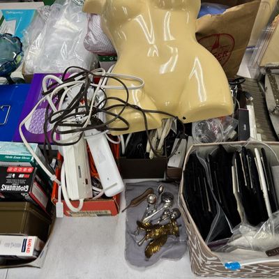 Sale Photo Thumbnail #408: Includes jewelry props, jewelry bags, jewelry boxes, and other jewelry supplies. Also includes storage, electrical cords, multi-plugs, binders, folders, light bulbs, a 1920s miniature metal airplane hangar, first aid supplies, glycine bags, and so much mo