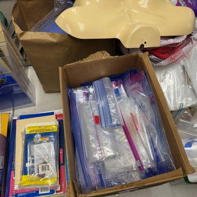 Sale Photo Thumbnail #403: Includes jewelry props, jewelry bags, jewelry boxes, and other jewelry supplies. Also includes storage, electrical cords, multi-plugs, binders, folders, light bulbs, a 1920s miniature metal airplane hangar, first aid supplies, glycine bags, and so much mo