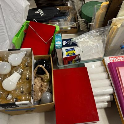 Sale Photo Thumbnail #404: Includes jewelry props, jewelry bags, jewelry boxes, and other jewelry supplies. Also includes storage, electrical cords, multi-plugs, binders, folders, light bulbs, a 1920s miniature metal airplane hangar, first aid supplies, glycine bags, and so much mo
