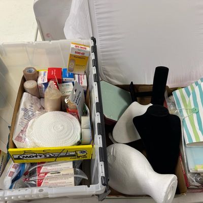 Sale Photo Thumbnail #405: Includes jewelry props, jewelry bags, jewelry boxes, and other jewelry supplies. Also includes storage, electrical cords, multi-plugs, binders, folders, light bulbs, a 1920s miniature metal airplane hangar, first aid supplies, glycine bags, and so much mo