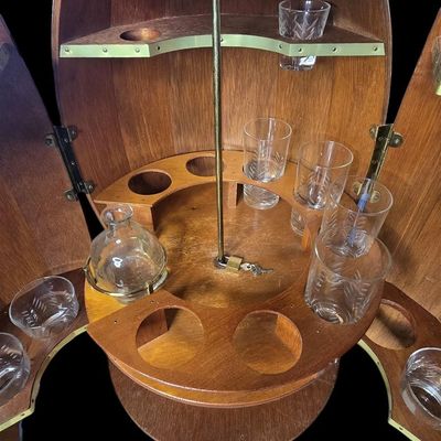 Sale Photo Thumbnail #3: 1) Vintage Wooden Barrel Bar Cabinet with Spinning Bottle Rack and Mixed Glasses.                           