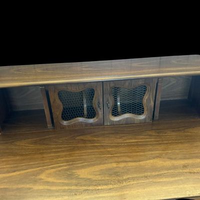 Sale Photo Thumbnail #60: 39.50"T × 40"W × 22"D French Country / Provincial Style Desk with Wire-Insert Hutch  features upper hutch with center storage cubbies and dual cabinet doors with chicken wire mesh inserts  molded center drawer with ornamental brass bail handle  and cabr