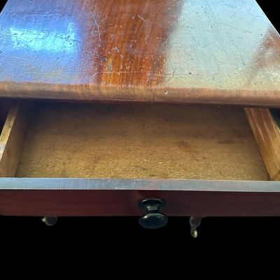 Sale Photo Thumbnail #129: 42"W (leaves) / 24"W (no leaves) × 45"L × 29"T Vintage Solid Wood Drop-Leaf Dining Table  features two fold-down end leaves and tapered legs and silverware drawer. Measurements: 42" wide w/leaves  24" w/o leaves  45" length  29" tall. Local  .  