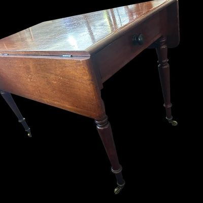 Sale Photo Thumbnail #125: 42"W (leaves) / 24"W (no leaves) × 45"L × 29"T Vintage Solid Wood Drop-Leaf Dining Table  features two fold-down end leaves and tapered legs and silverware drawer. Measurements: 42" wide w/leaves  24" w/o leaves  45" length  29" tall. Local  .  