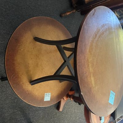 Sale Photo Thumbnail #157: 36" round × 17.5"T and 26.5" round × 25"T. Two matching-style round wood tables with dark legs and stretchers. One is 36" round × 17.5" tall (coffee table height). The other is 26.5" round × 25" tall (side table height). Local   in   / Shreveport area