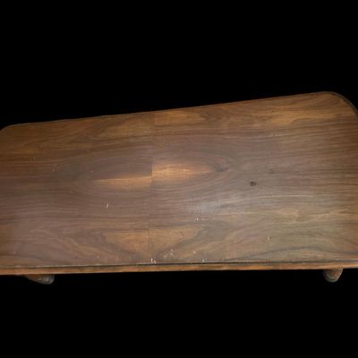 Sale Photo Thumbnail #276: 48"L × 20"D × 17.5"T Rectangular solid wood coffee table featuring deeply carved geometric oval/circle pattern apron  turned legs  and rounded top corners. Dimensions: 48" Long x 20" Deep x 17.50" Tall.  