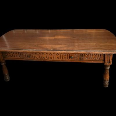 Sale Photo Thumbnail #275: 48"L × 20"D × 17.5"T Rectangular solid wood coffee table featuring deeply carved geometric oval/circle pattern apron  turned legs  and rounded top corners. Dimensions: 48" Long x 20" Deep x 17.50" Tall.  