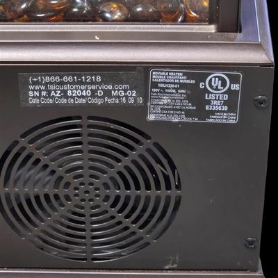 Sale Photo Thumbnail #370: Duraflame 28-inch heavy-duty infrared quartz electric lantern heater (Model AZ-82040 / 10ILH117 series) in a bronze finish. Features a 1400W/1500W infrared heating element (heats up to 1,000 sq ft), flickering LED pillar candle over amber glass rocks, tou