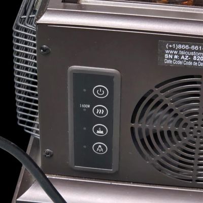 Sale Photo Thumbnail #369: Duraflame 28-inch heavy-duty infrared quartz electric lantern heater (Model AZ-82040 / 10ILH117 series) in a bronze finish. Features a 1400W/1500W infrared heating element (heats up to 1,000 sq ft), flickering LED pillar candle over amber glass rocks, tou
