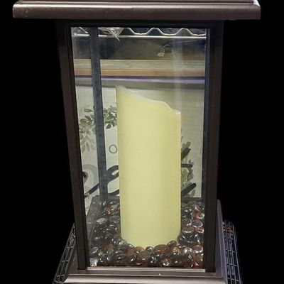 Sale Photo Thumbnail #365: Duraflame 28-inch heavy-duty infrared quartz electric lantern heater (Model AZ-82040 / 10ILH117 series) in a bronze finish. Features a 1400W/1500W infrared heating element (heats up to 1,000 sq ft), flickering LED pillar candle over amber glass rocks, tou