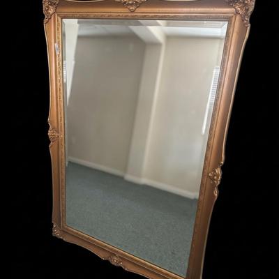 Sale Photo Thumbnail #375: Large rectangular wall mirror featuring a contoured metallic antique gold frame with ornate corner crest carvings and a beveled glass pane. Items may be held with pre-payment or a deposit. We are not scammers  you can check our track record  and we are ve