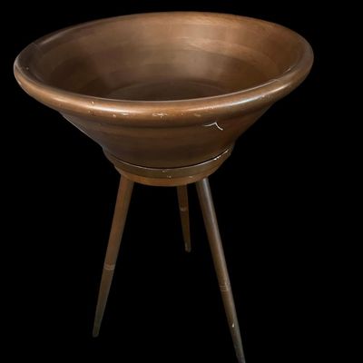 Sale Photo Thumbnail #376: Mid-century solid turned wood deep bowl mounted on a swivel tripod base with splayed wooden peg legs; features a smooth spinning top bowl mechanism. Items may be held with pre-payment or a deposit. We are not scammers  you can check our track record  and 