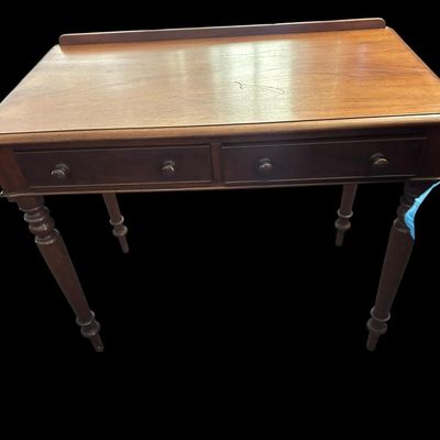 Sale Photo Thumbnail #501: 31 X 23 X 48 Antique Colonial Style Walnut 2-Drawer Writing Desk  features low back gallery guard rail  2 drawers with wooden turn knobs  turned spindle legs  and solid wood construction with light surface age patina.  