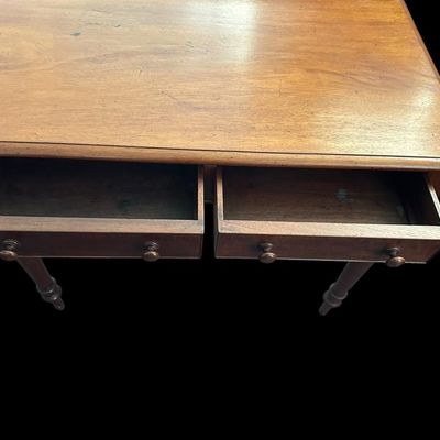 Sale Photo Thumbnail #503: 31 X 23 X 48 Antique Colonial Style Walnut 2-Drawer Writing Desk  features low back gallery guard rail  2 drawers with wooden turn knobs  turned spindle legs  and solid wood construction with light surface age patina.  