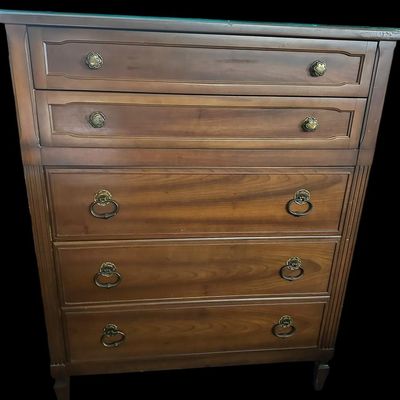 Sale Photo Thumbnail #506: 37 X 19 X 46 Vertical 5-drawer tall chest featuring two upper molded drawers with floral brass knobs over three deep lower drawers with ornate drop-ring handles  reeded side pilasters  and bracket feet. Includes fitted protective glass top panel.  
