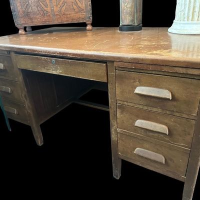 Sale Photo Thumbnail #635: 60"W × 34"D × 30"H Heavy-duty solid wood office desk featuring 6 side storage drawers with carved integrated wood pulls  central locking pencil drawer  and spacious working surface with character wear and age patina. Dimensions: 60" Wide x 34" Deep x 30
