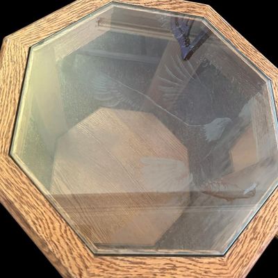 Sale Photo Thumbnail #669: 20 x 22 each Pair of 8-sided solid oak octagonal accent end tables featuring inset etched glass tops—one featuring a flying bald eagle scene and the other featuring a grizzly bear in wilderness—over lower open display shelves. 20 x 22 each.   
