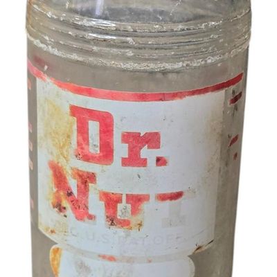 Sale Photo Thumbnail #804:  Dr. Nut 7 oz New Orleans regional soda bottle. Label damaged.                           
