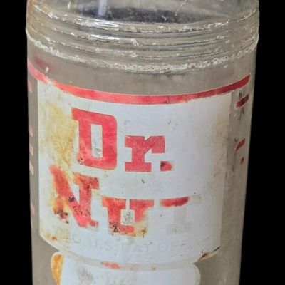Sale Photo Thumbnail #801:  Dr. Nut 7 oz New Orleans regional soda bottle. Label damaged.                           