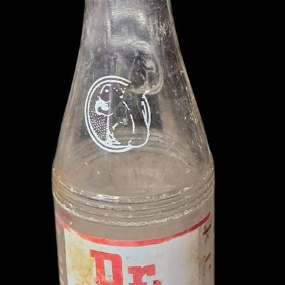 Sale Photo Thumbnail #800:  Dr. Nut 7 oz New Orleans regional soda bottle. Label damaged.                           