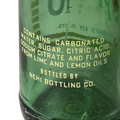 Sale Photo Thumbnail #825:  Upper 10 10 oz bottle.                           
