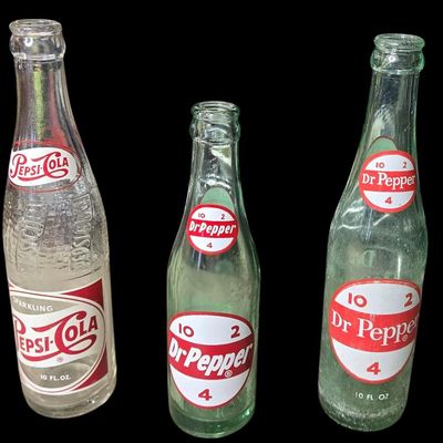 Sale Photo Thumbnail #834:  Lot of 3 soda bottles: 2 Dr Pepper / 1 Pepsi.                           