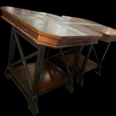 Sale Photo Thumbnail #850: Pair of square accent tables featuring tops set with multi-color natural slate tile cross inserts and parquet wood panels over dark metal X-brace bases and lower wooden display shelves.  