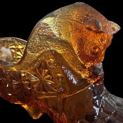 Sale Photo Thumbnail #898:  Amber pressed-glass slipper with cat on the heel. Fenton-style novelty. Check ear for chips.                           