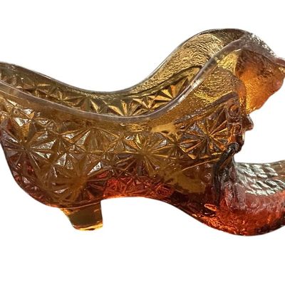 Sale Photo Thumbnail #900:  Amber pressed-glass slipper with cat on the heel. Fenton-style novelty. Check ear for chips.                           