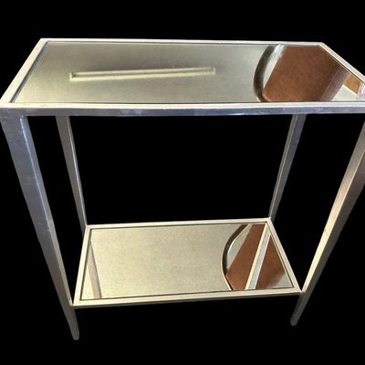 Sale Photo Thumbnail #906: 22"T × 20"W × 10"D Modern rectangular side/telephone table featuring a brushed silver metal frame with a mirrored glass top surface and mirrored lower shelf tier. Dimensions: 22" Tall x 20" Wide x 10" Deep.  