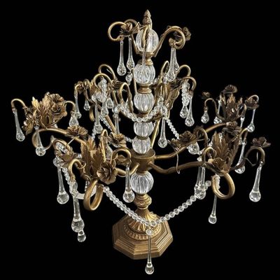 Sale Photo Thumbnail #915: Vintage Hollywood Regency style decorative tabletop centerpiece (epergne style) in an antique gold gilt finish. Features a central fluted glass urn column supporting sweeping scrolled brass arms adorned with dimensional carved brass rose blooms and foliag
