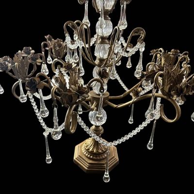 Sale Photo Thumbnail #918: Vintage Hollywood Regency style decorative tabletop centerpiece (epergne style) in an antique gold gilt finish. Features a central fluted glass urn column supporting sweeping scrolled brass arms adorned with dimensional carved brass rose blooms and foliag