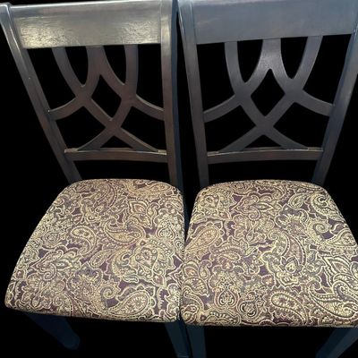 Sale Photo Thumbnail #925: Pair of contemporary side dining chairs with ebony wood frames  intersecting curved backrest splats  and rich woven brown/gold paisley tapestry seat cushions.  