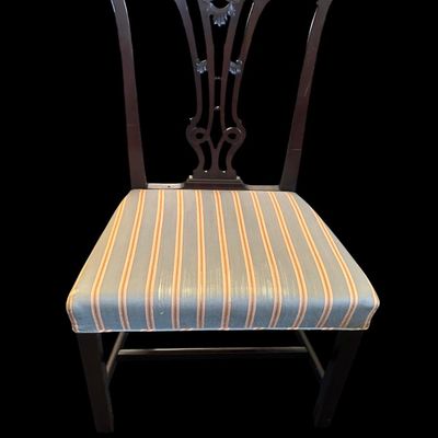Sale Photo Thumbnail #945: Traditional mahogany accent dining/side chair featuring carved pierced splat backrest with central rosette motif  stretchered square legs  and blue/gold striped fabric seat.  
