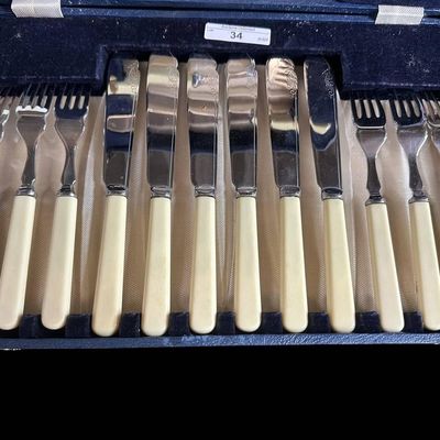 Sale Photo Thumbnail #948:  Vintage Stainless Steel Fish Set With Cream-Colored Handles and Case.                           